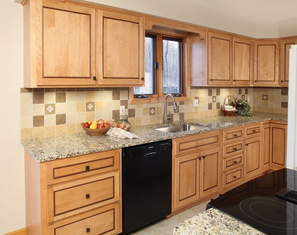 Kitchen sink and countertop, featuring a gray sink and white marble countertop.