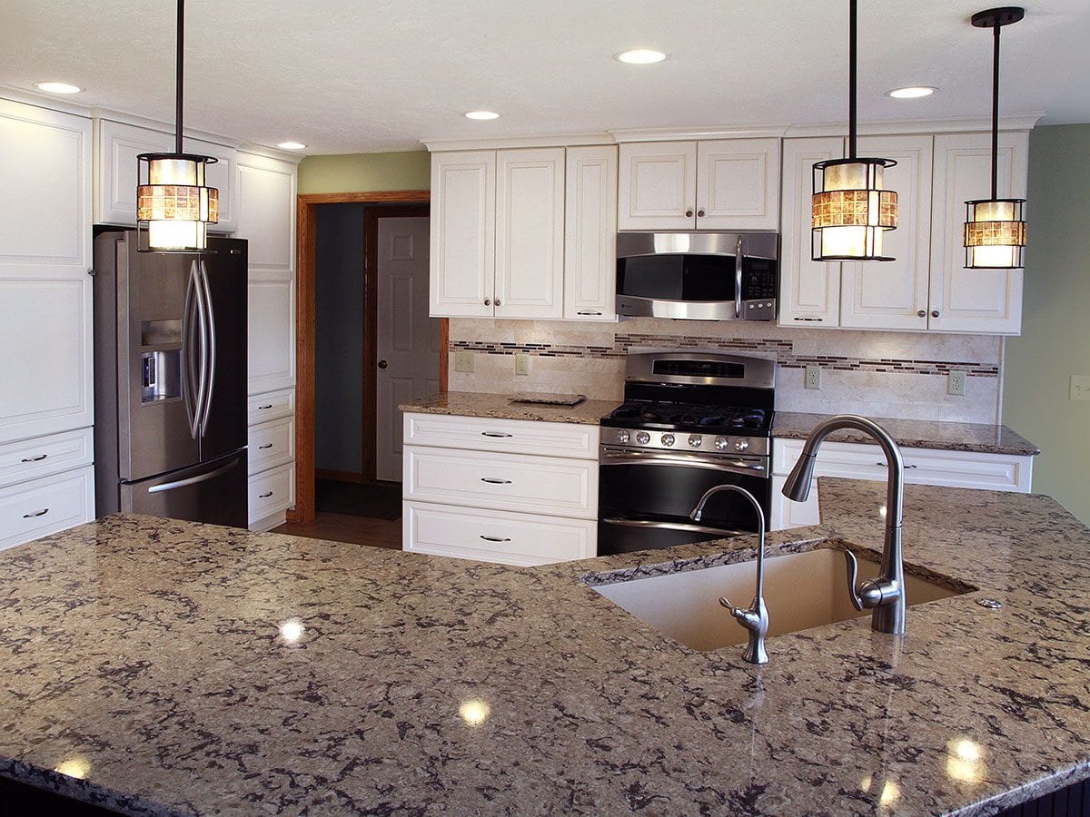 Contemporary kitchen featuring an oversized kitchen island with sink