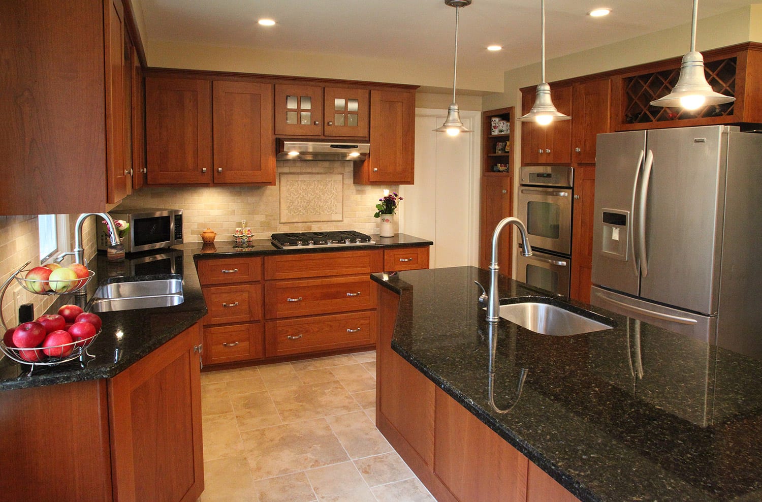 Modern kitchen featuring a large island with second sink