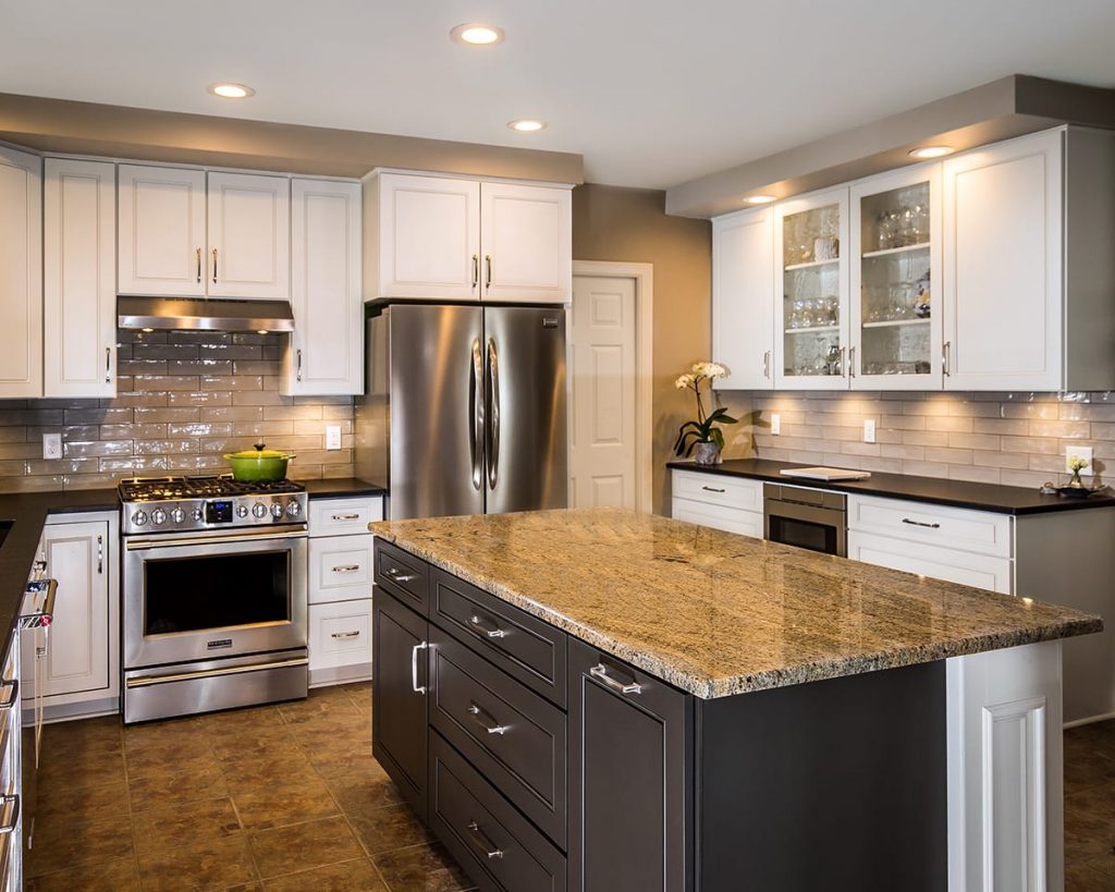 Contemporary kitchen with kitchen island featuring a pull-out trash bin cabinet