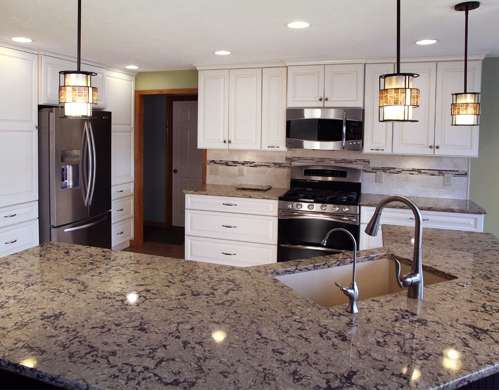 Contemporary kitchen featuring an oversized kitchen island with sink