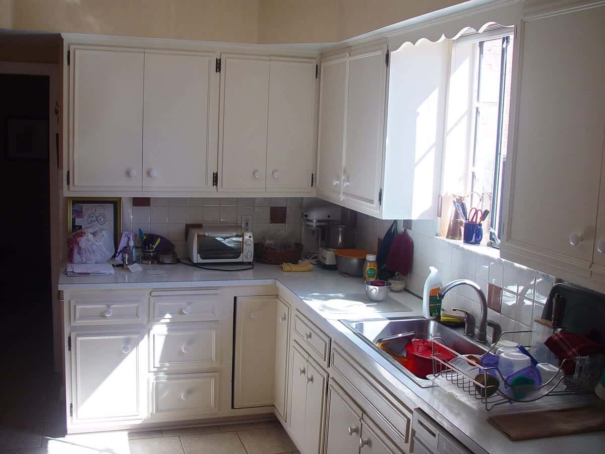 White on white outdated kitchen before remodeling by American Wood Reface