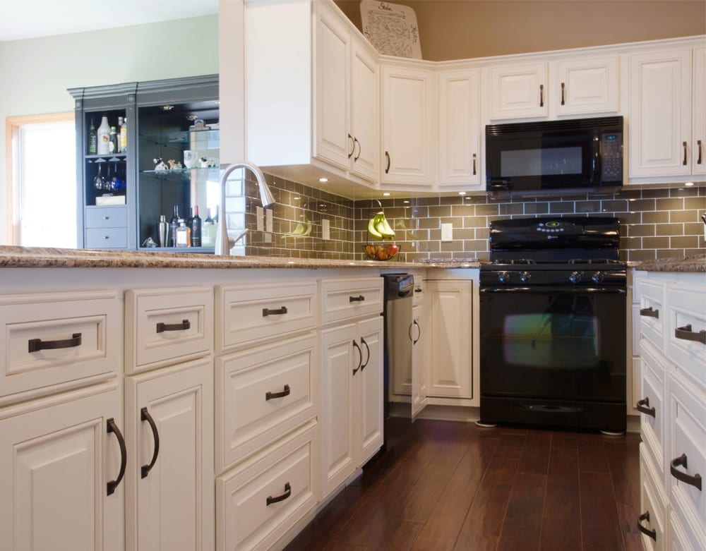 Traditional remodeled kitchen with new flooring and countertops by American Wood Reface