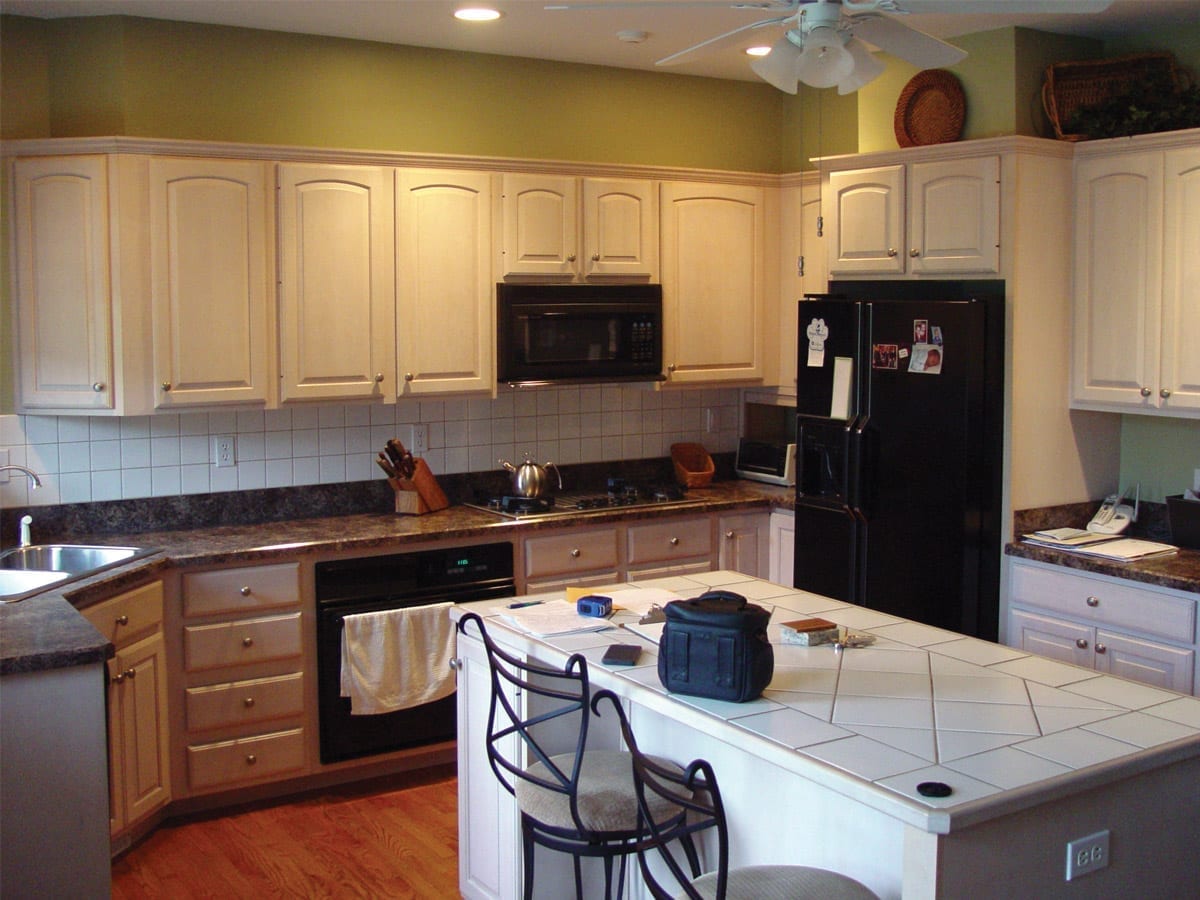 White on white outdated kitchen before remodeling by American Wood Reface