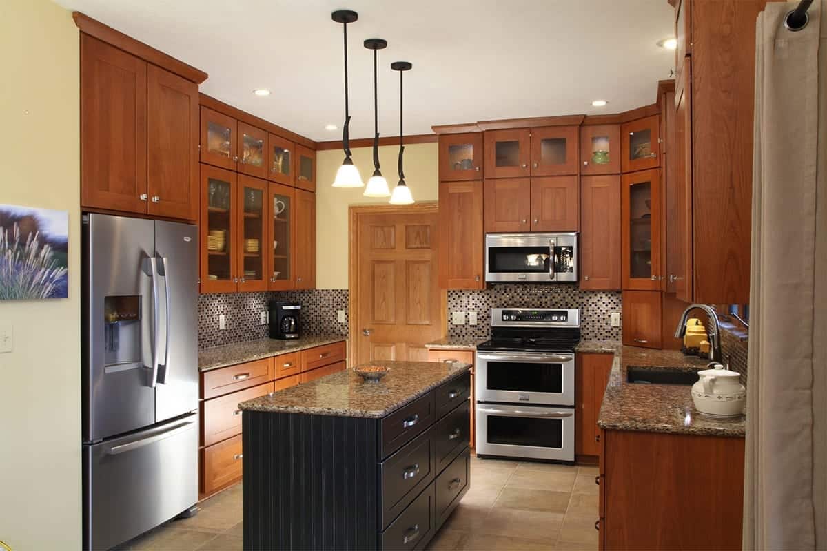 Kitchen Remodeling project after refacing the kitchen in a brown color and beautiful tile center island