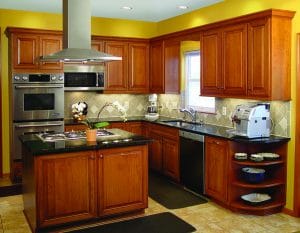 newly refaced kitchen with cherry wood cabinets