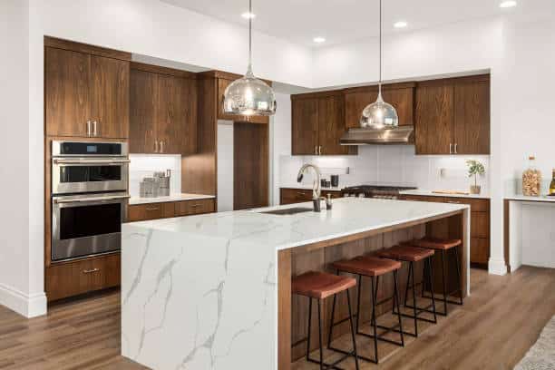 Classic white countertop with wooden cabinets.