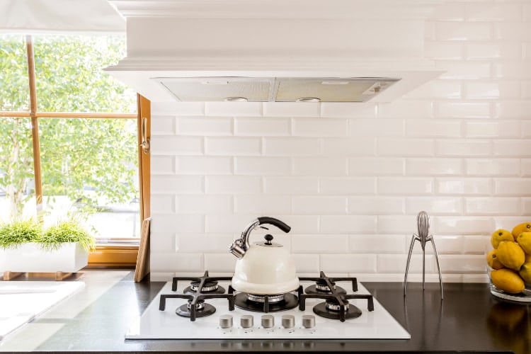 White brick kitchen backsplash.