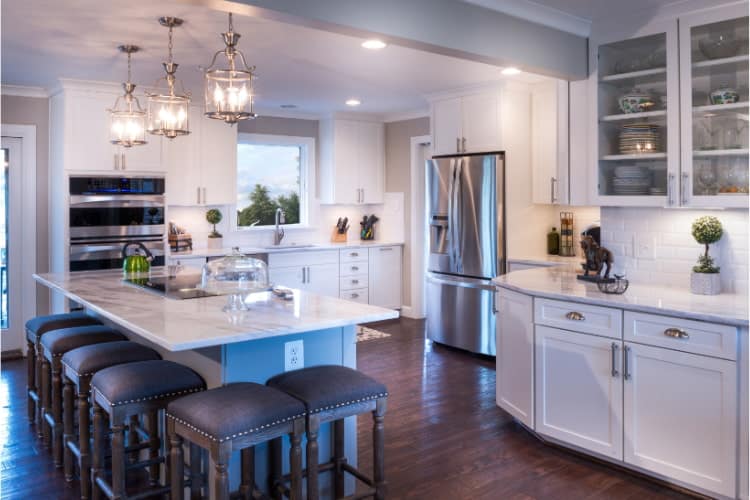 White modern luxury kitchen with modern white countertops.