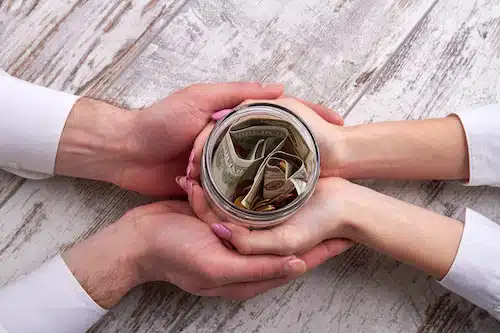 couple being able to save more on their savings jar with  cost-saving cabinet refacing