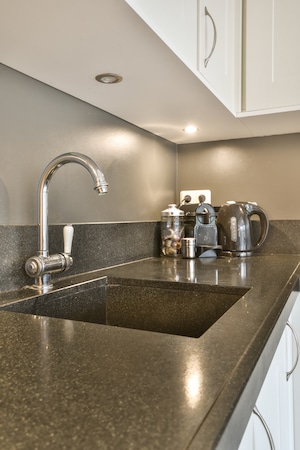 matching wood refaced cabinets color and style with granite countertops