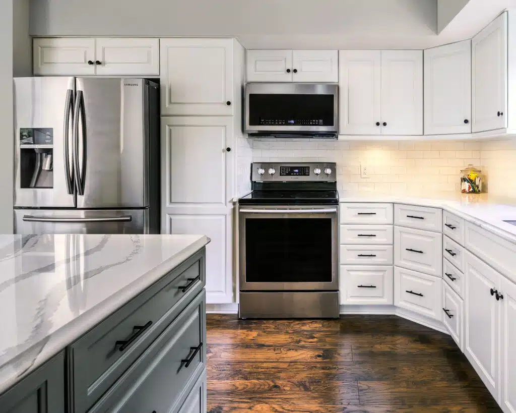 Contact American Wood Reface to schedule a free in-home consultation. Elegant kitchen with newly refaced cabinets and decorative crown molding.
